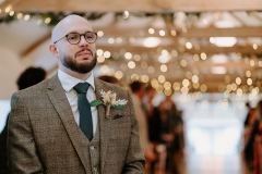 The groom waits nervously