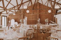 Teh Red Brick Barn with round tables