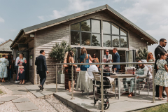 Guests enjoying a drink on the patio of the Green Room bar