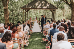 During the vows at an outdoor ceremony at the Lawn Arbour