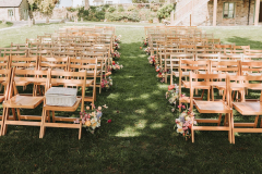 The chairs set up for an outdoor ceremony