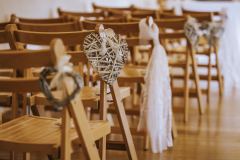 The chairs set u up in the wedding barn