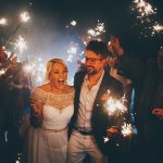 A couple having a sparkler exit