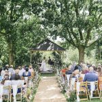 Wedding ceremony at the green in cornwall at the lawn arbour