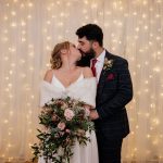 The just married bride and groom in the wedding barn
